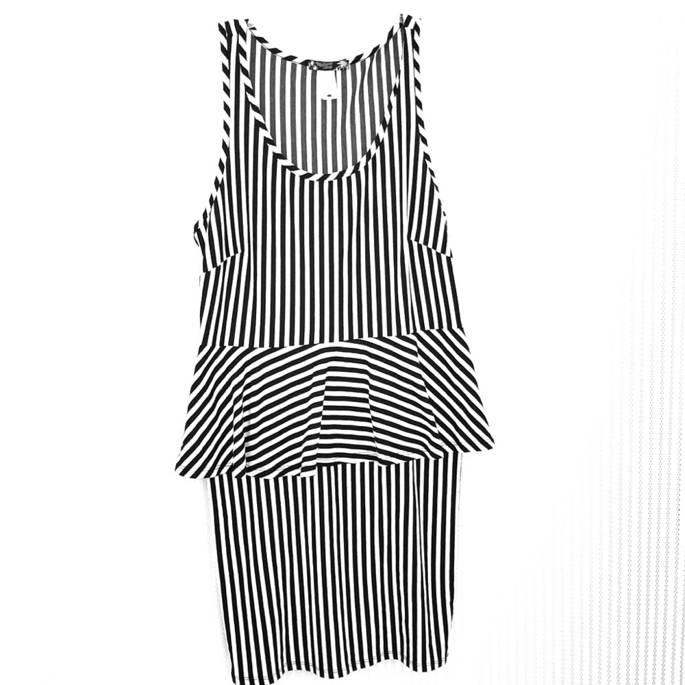 Sleeveless tank dress. Roomy bust narrow leg.